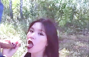 Asian girl loves from behind in the forest