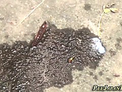 Asian teen peeing outside